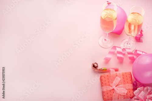 Champagne, gift, bow. Invitation, birthday, party on the occasion of girlhood, the concept of a baby shower, a holiday on a pink background. Banner for inscriptions, announcements for birthday