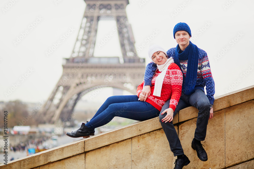 Happy couple near the Eiffel tower on a winter day Happy couple near the Eiffel tower on a winter day
