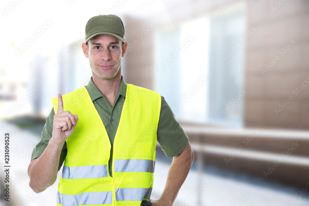 security agent with green shirt guarding a building security agent with green shirt guarding a building