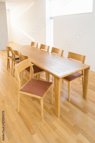 an eight-person wooden table and chair