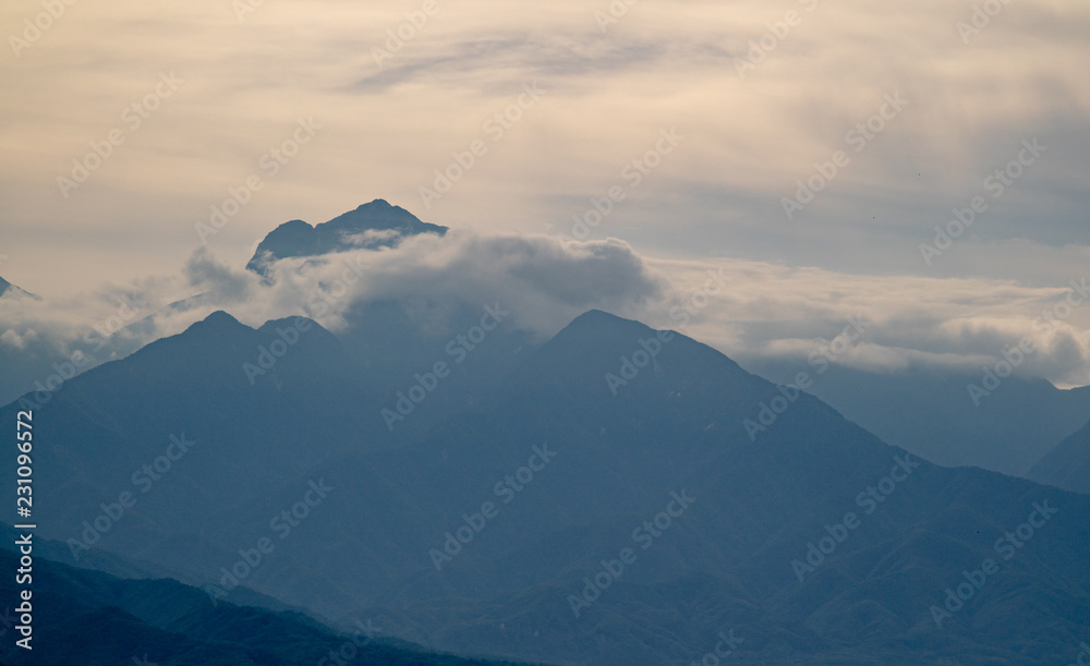 Japanese mountains, covered in clouds and haze in the autumn