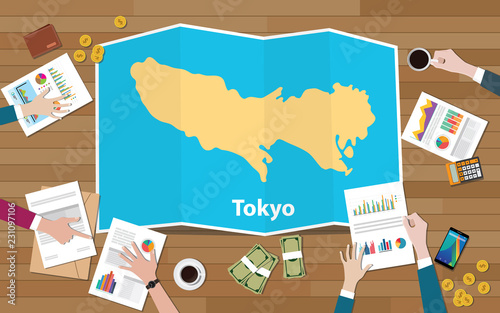 tokyo japan capital city region economy growth with team discuss on fold maps view from top