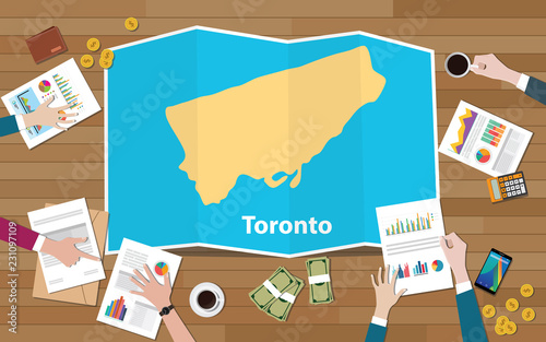 toronto ontario city region economy growth with team discuss on fold maps view from top