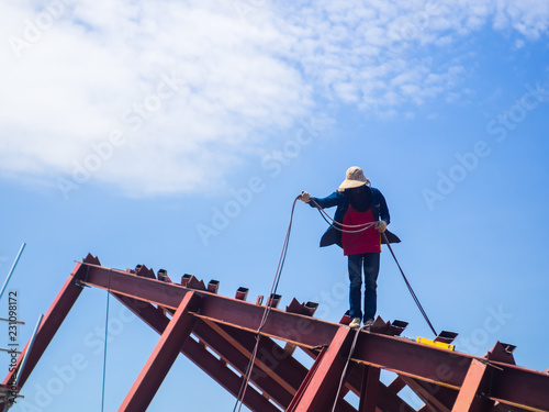 Wallpaper Mural The Welder man a welding the steel roof, worker with unprotected and unsafely, Electric iron oxide. Torontodigital.ca