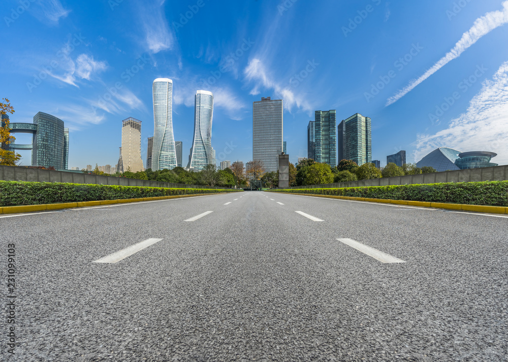 city road through modern buildings in hangzhou city road through modern buildings in hangzhou