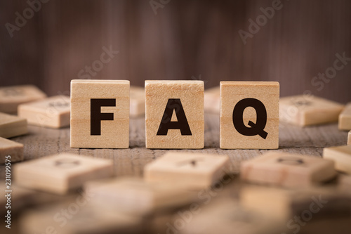 FAQ Sign With Wooden Background photo