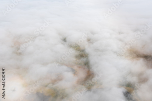 Aerial view above clouds and fog looking down at fall color on the Alaskan tundra, Katmai National Park, Alaska, USA   © knelson20