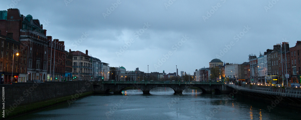 A bridge over Liffey river in Dublin. Cloudy afternoon
