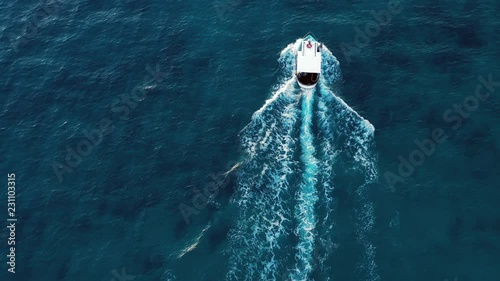 Video from above, aerial view of a beautiful fishing boat that sails in the Mediterranean sea. Sardinia, Italy.