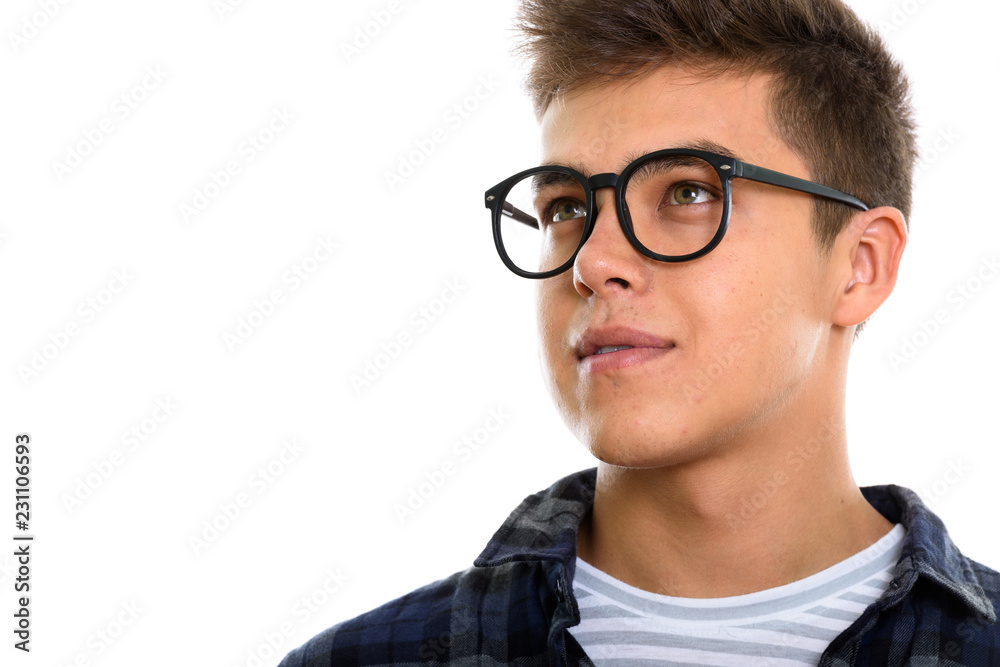 Close up of young handsome man wearing eyeglasses while thinking
