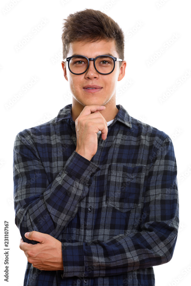 Studio shot of young handsome man thinking Studio shot of young handsome man thinking