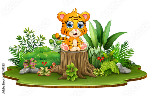 Fototapeta Naklejka Na Ścianę i Meble -  Cartoon happy baby tiger sitting on tree stump with green plants
