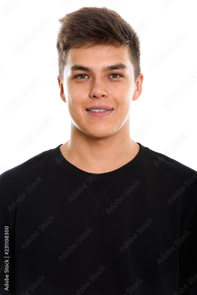 Studio shot of young handsome man looking at camera