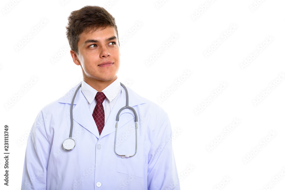 Studio shot of young handsome man doctor thinking Studio shot of young handsome man doctor thinking