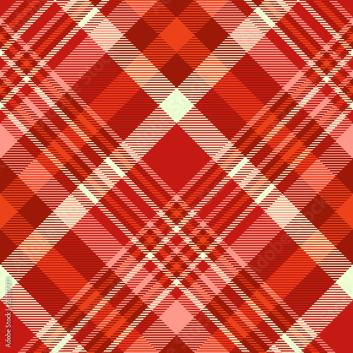 Seamless plaid pattern in shades of red, pink and yellow.