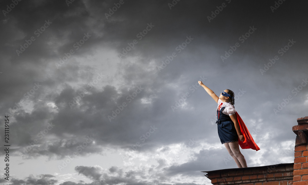 Little kid protecting the city from evil. Mixed media Little kid protecting the city from evil. Mixed media