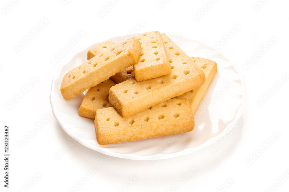 A photo of a plate of Scottish shortbread butter cookies on a white background with copy space A photo of a plate of Scottish shortbread butter cookies on a white background with copy space