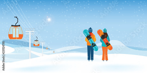 Couple Snowboarders standing with snowboards.