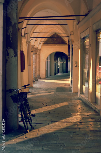 Montagnana, Italy August 6, 2018: Beautiful city street with pedestrian arches. photo