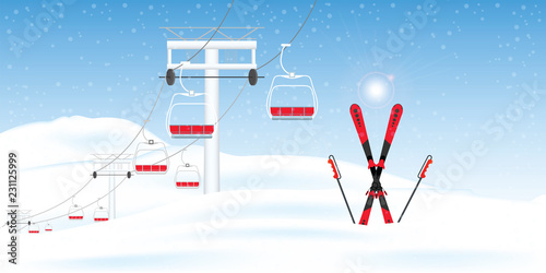 Winter ski resort with ski-lift moving above the ground against winter landscape.