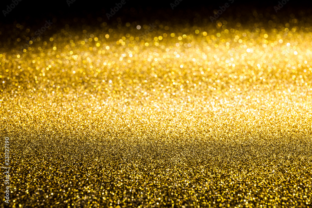 The surface of gold sparkling spangles. Background for glamor