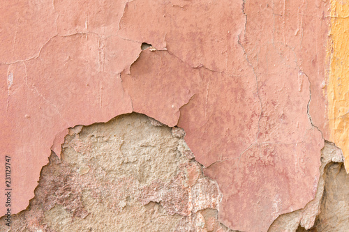 Grunge weathered texture. Close up old wall peeling plaster.