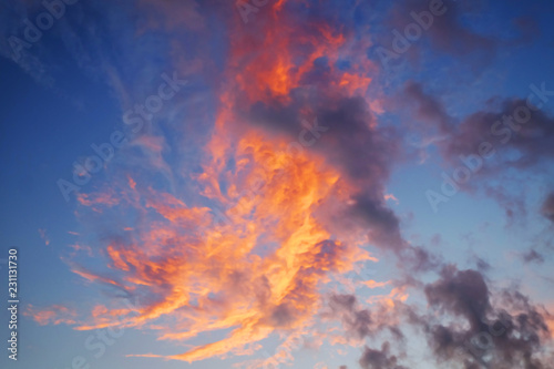 Wide angle of pink cumulus clouds on dusk cloudy sky