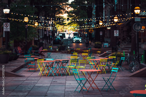 Colourful restaurant terrace in a city center during summer afternoon