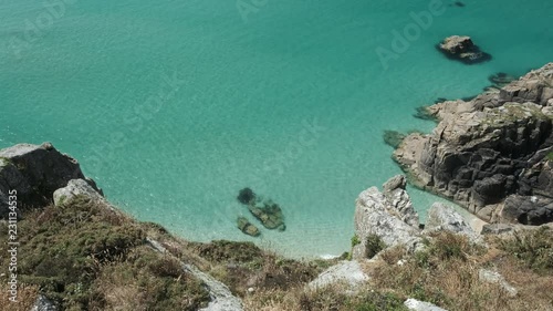 view over clear blue rippling sea at Pedn Vounder Beach, nerviest Porthcurno, south Cornwall on a summers day.