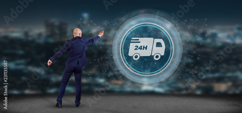 Businessman in front of a Fast delivery button with connection 3d rendering