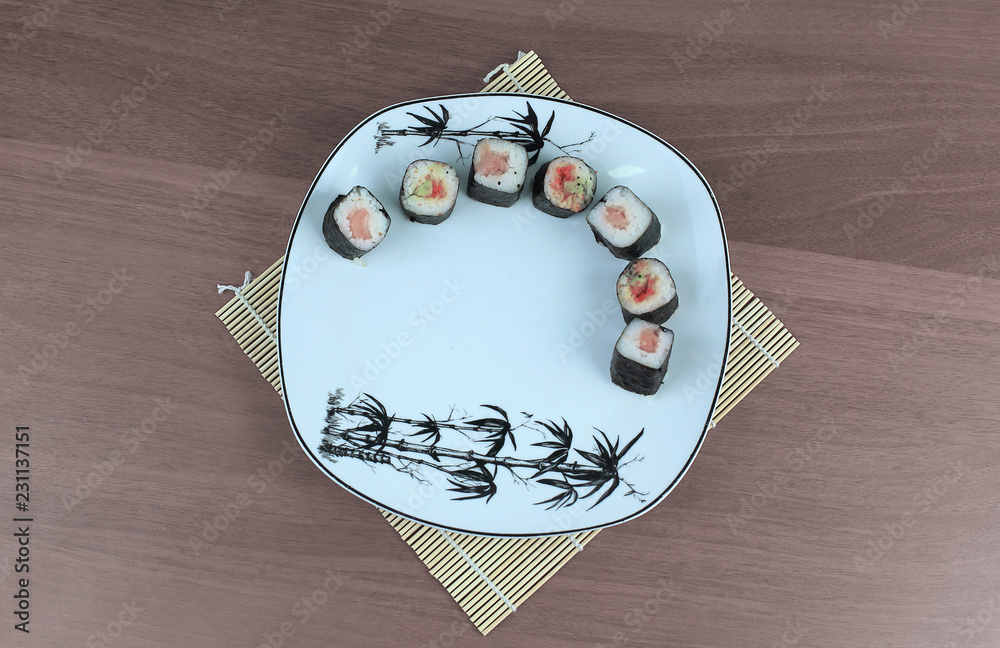 Wunschmotiv: close-up of sushi and chopsticks on a white plate #231137151