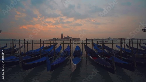 4K time lapse of beautiful view of gondolas, water taxis, and vaporetto passing by a beautiful cathedral on the Grand Canal in Venice, Italy, Europe