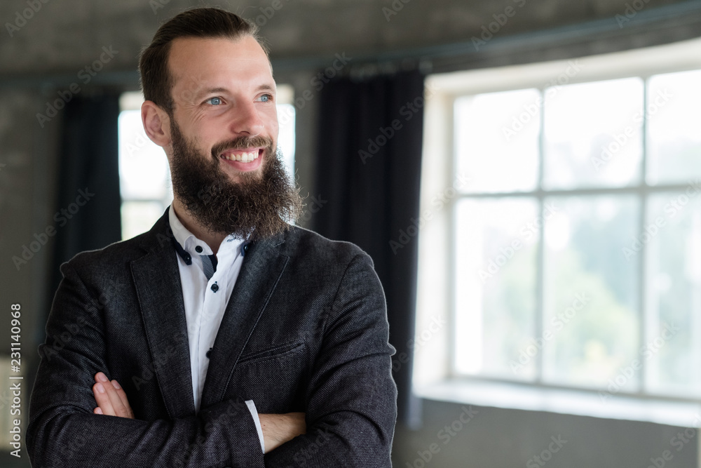 smiling man with crossed arms. confident business trainer or entrepreneur. smiling man with crossed arms. confident business trainer or entrepreneur.