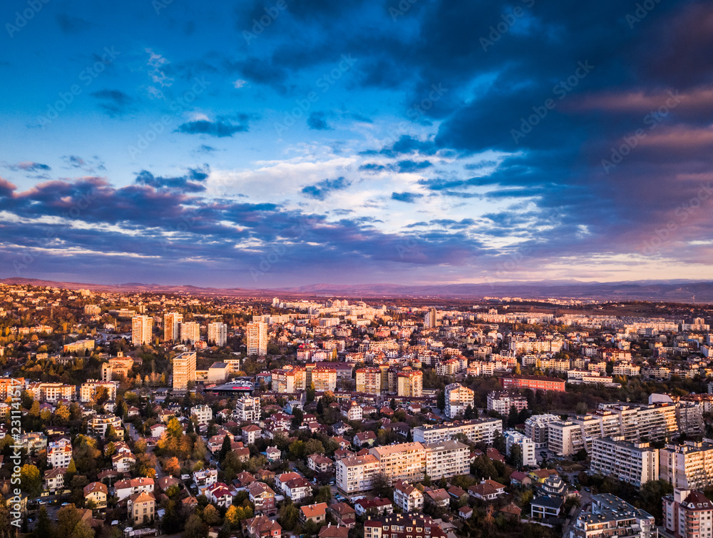 Beautiful drone shot of a vivid sunrise over Sofia, Bulgaria - impressive image with colourful skies and amazing aerial views over the city.