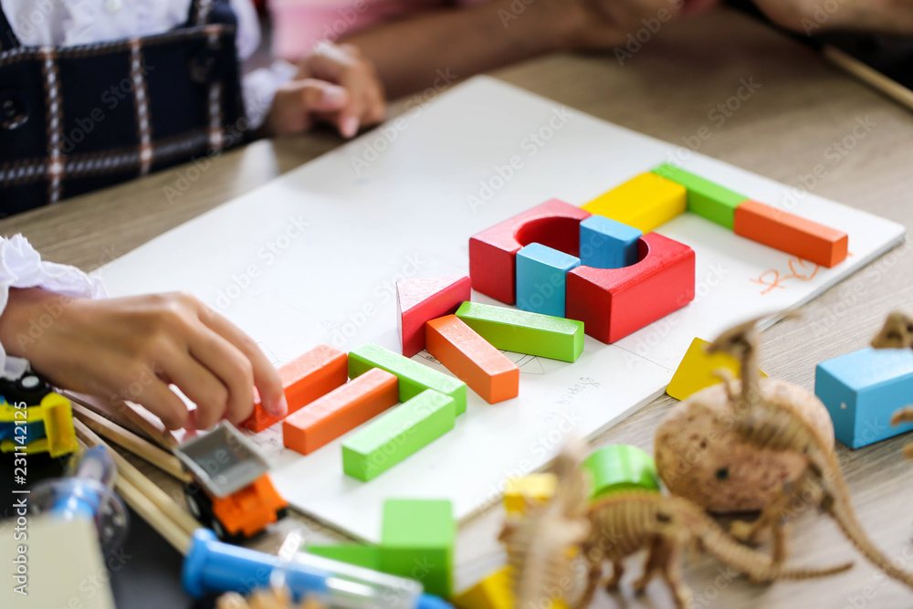Parent and little child having fun playing educational toys,Family concept. Parent and little child having fun playing educational toys,Family concept.