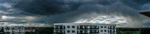 Panorama of a dramatic stormy sky over the urban area.