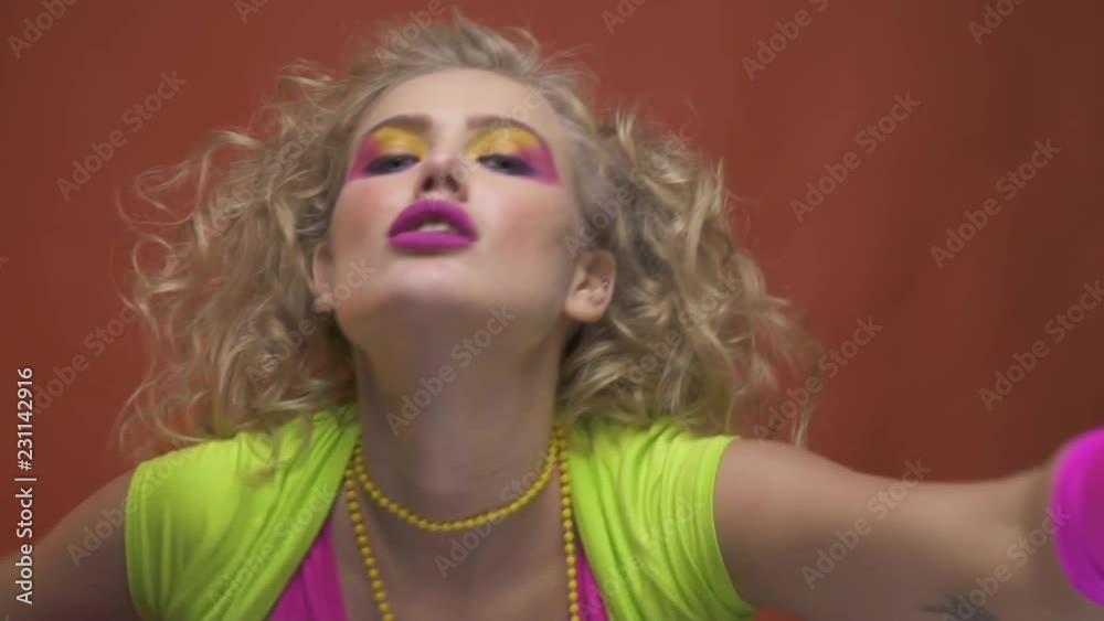 80s girl in colorful clothes, blows a lot of kisses, close up 80s girl in colorful clothes, blows a lot of kisses, close up