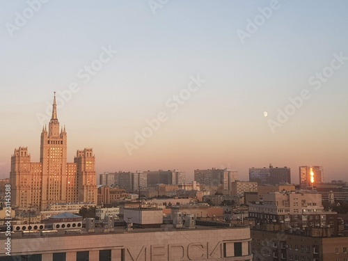 Moscow skyline with a Moon at sunset