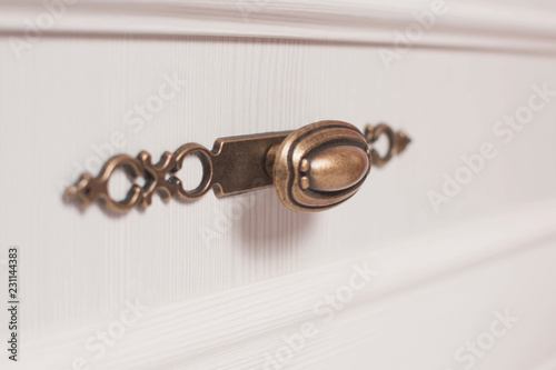  Furniture fittings. The handle of the chest of drawers (the color of Karelian pine). Neoclassical style.