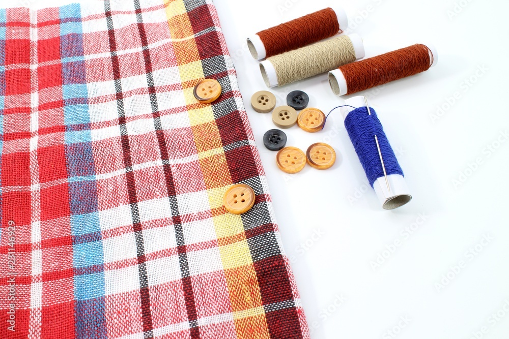 Button needle thread and fabric. Button needle thread and fabric.