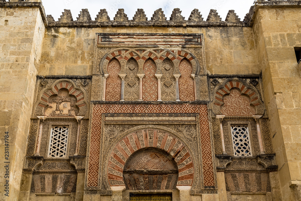 Beautiful decorations on the outside walls of Mezquita, a former Moorish Mosque that is now the Cathedral of Cordoba, Andalucia, Spain. Mezquita is a UNESCO World Heritage Site.