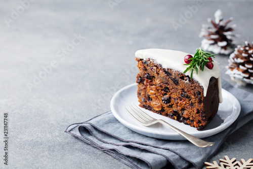 Christmas fruit cake, pudding on white plate. Copy space.