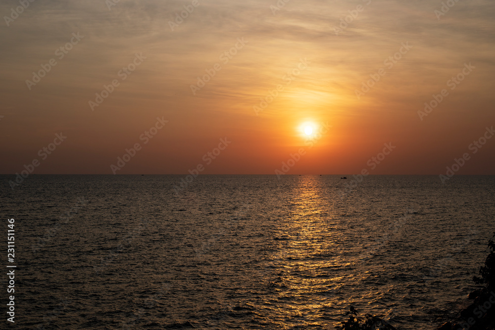 Tropical sea and red sun. Orange sunset landscape. Romantic evening seascape with sunset.