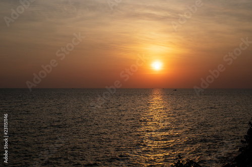 Tropical sea and red sun. Orange sunset landscape. Romantic evening seascape with sunset. © Elya.Q