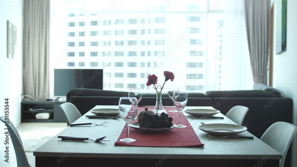 Beautiful serving table banquet in modern apartment by the window Beautiful serving table banquet in modern apartment by the window