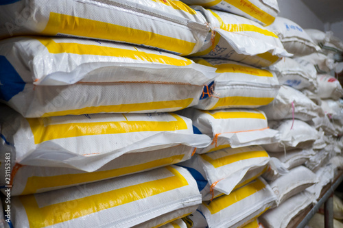 Pile of sack in warehouse. Background and texture of sack stack in warehouse.