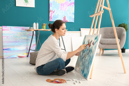 Female artist painting pict...