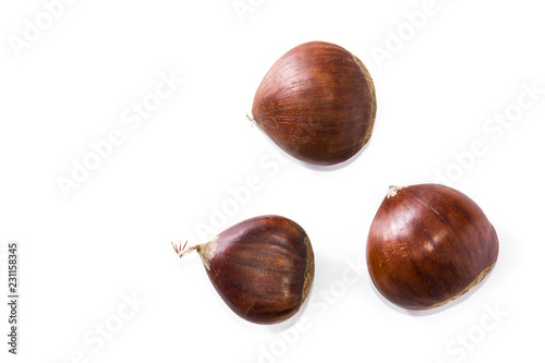 Raw chestnuts isolated on white background. Top view. Copyspace 