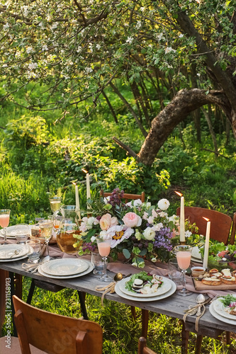 wedding decorated table, decor wedding dinner in nature in the garden