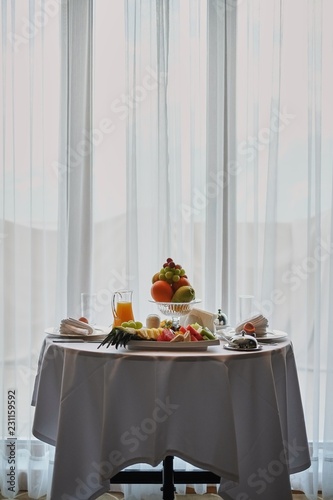 Delicious breakfast served for two at the hotel a white background. front view